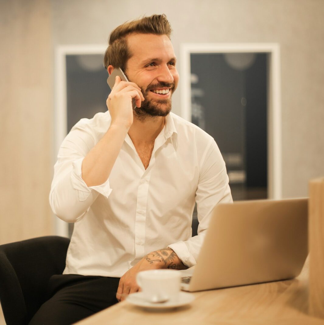 man using smartphone on chair